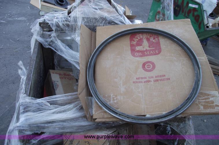 image for item E9569 Three wheel dump cart filled with assorted bearings and seals