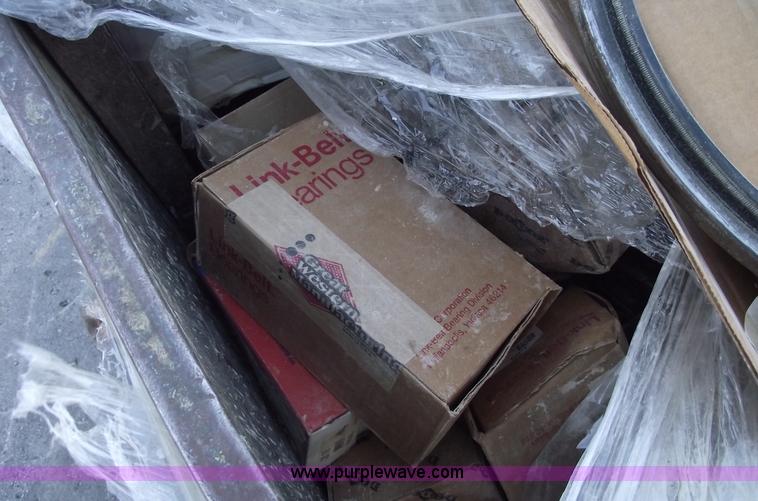 image for item E9569 Three wheel dump cart filled with assorted bearings and seals