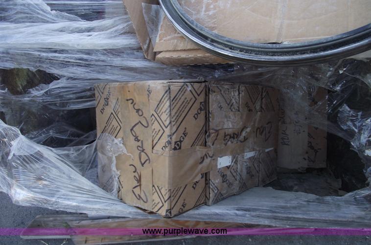 image for item E9569 Three wheel dump cart filled with assorted bearings and seals