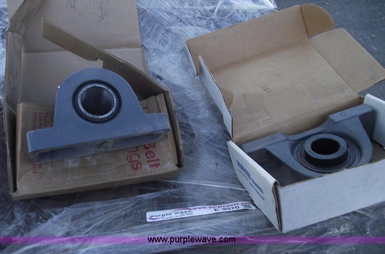 image for item E9569 Three wheel dump cart filled with assorted bearings and seals