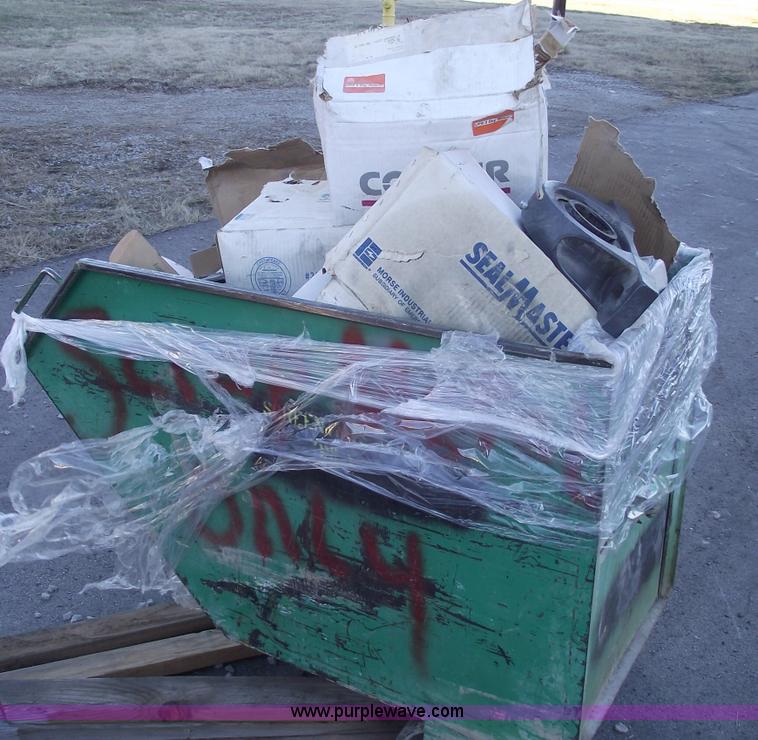 image for item E9570 Three wheel dump cart filled with assorted  bearings and seals