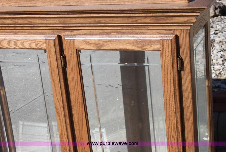 image for item F9955 Solid oak lighted china cabinet with hutch