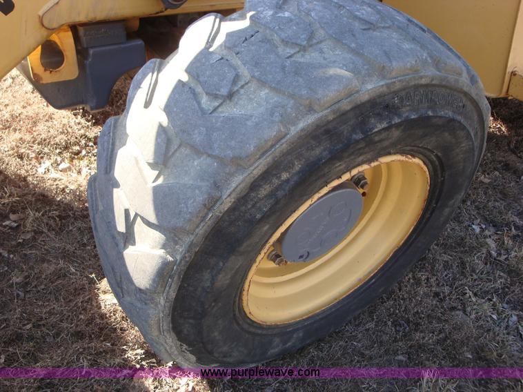 image for item A1821 1999 New Holland 555E backhoe