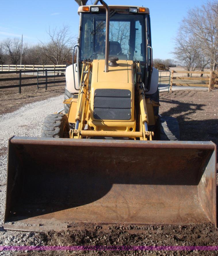 image for item A1821 1999 New Holland 555E backhoe