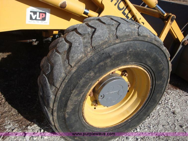 image for item A1821 1999 New Holland 555E backhoe