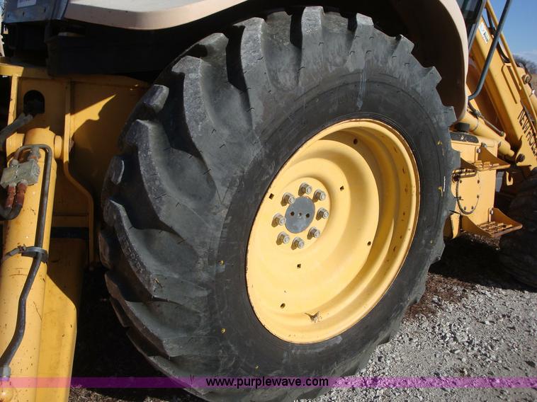 image for item A1821 1999 New Holland 555E backhoe