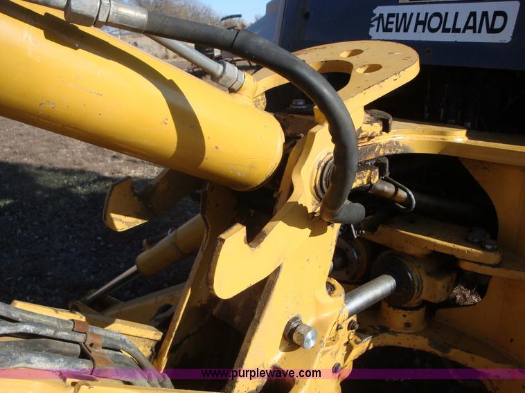 image for item A1821 1999 New Holland 555E backhoe