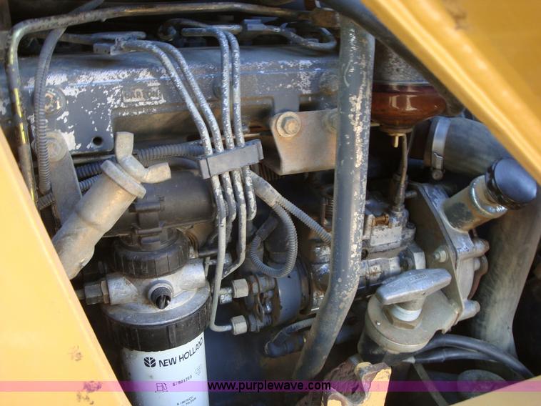 image for item A1821 1999 New Holland 555E backhoe