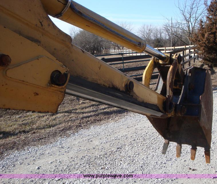 image for item A1821 1999 New Holland 555E backhoe