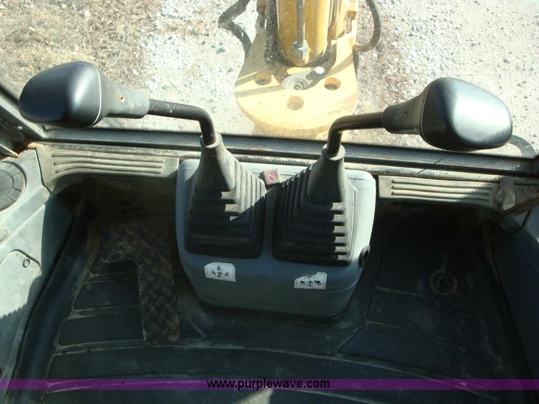 image for item A1821 1999 New Holland 555E backhoe