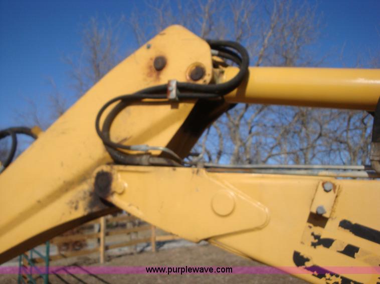 image for item A1821 1999 New Holland 555E backhoe