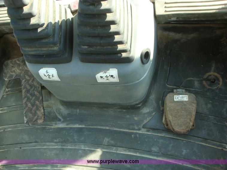 image for item A1821 1999 New Holland 555E backhoe