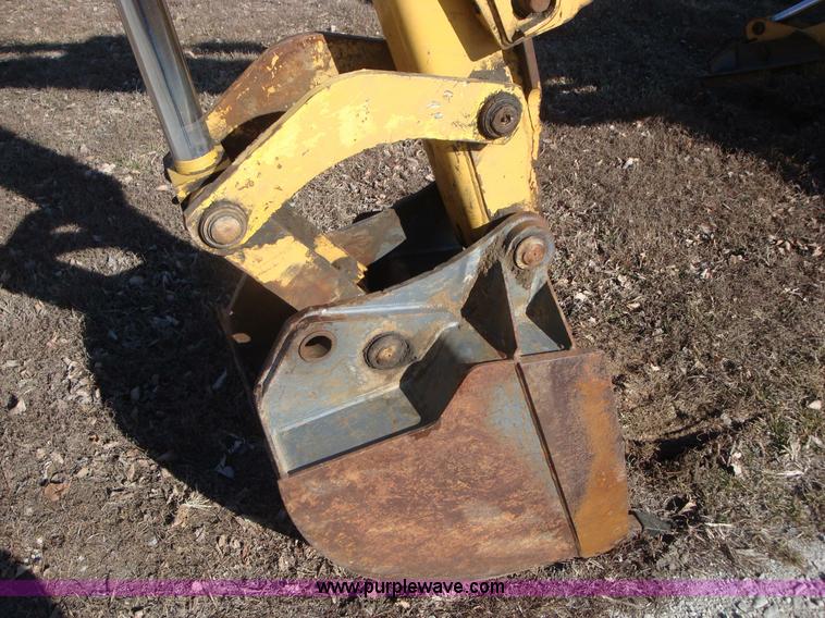 image for item A1821 1999 New Holland 555E backhoe