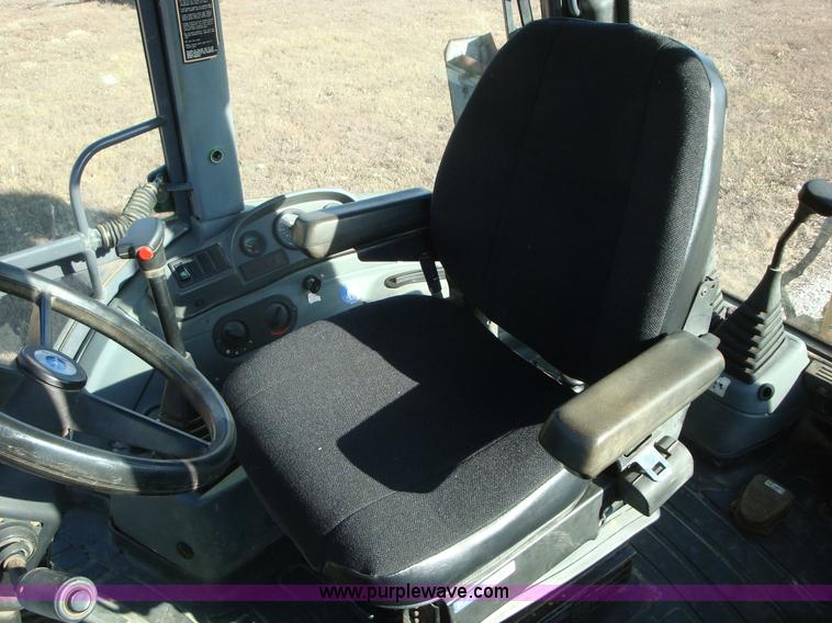 image for item A1821 1999 New Holland 555E backhoe