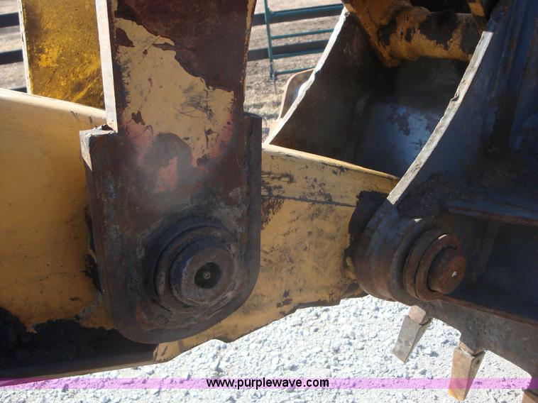 image for item A1821 1999 New Holland 555E backhoe