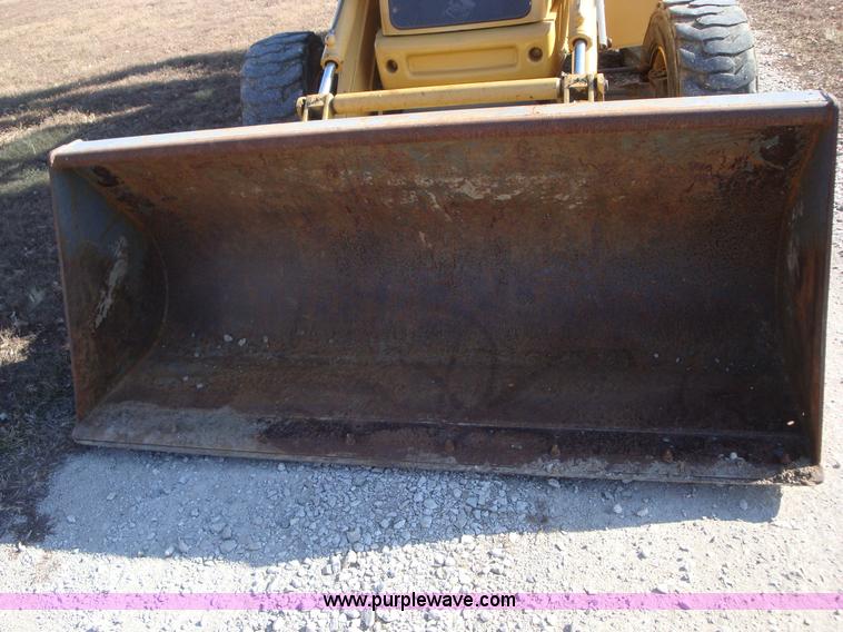 image for item A1821 1999 New Holland 555E backhoe