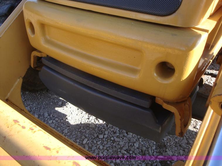 image for item A1821 1999 New Holland 555E backhoe