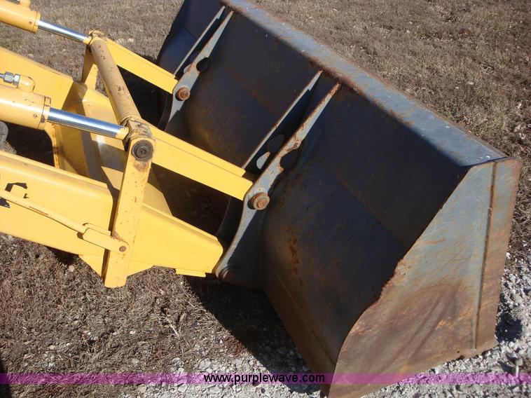 image for item A1821 1999 New Holland 555E backhoe