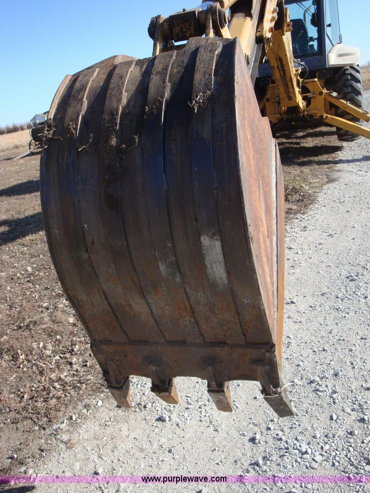 image for item A1821 1999 New Holland 555E backhoe