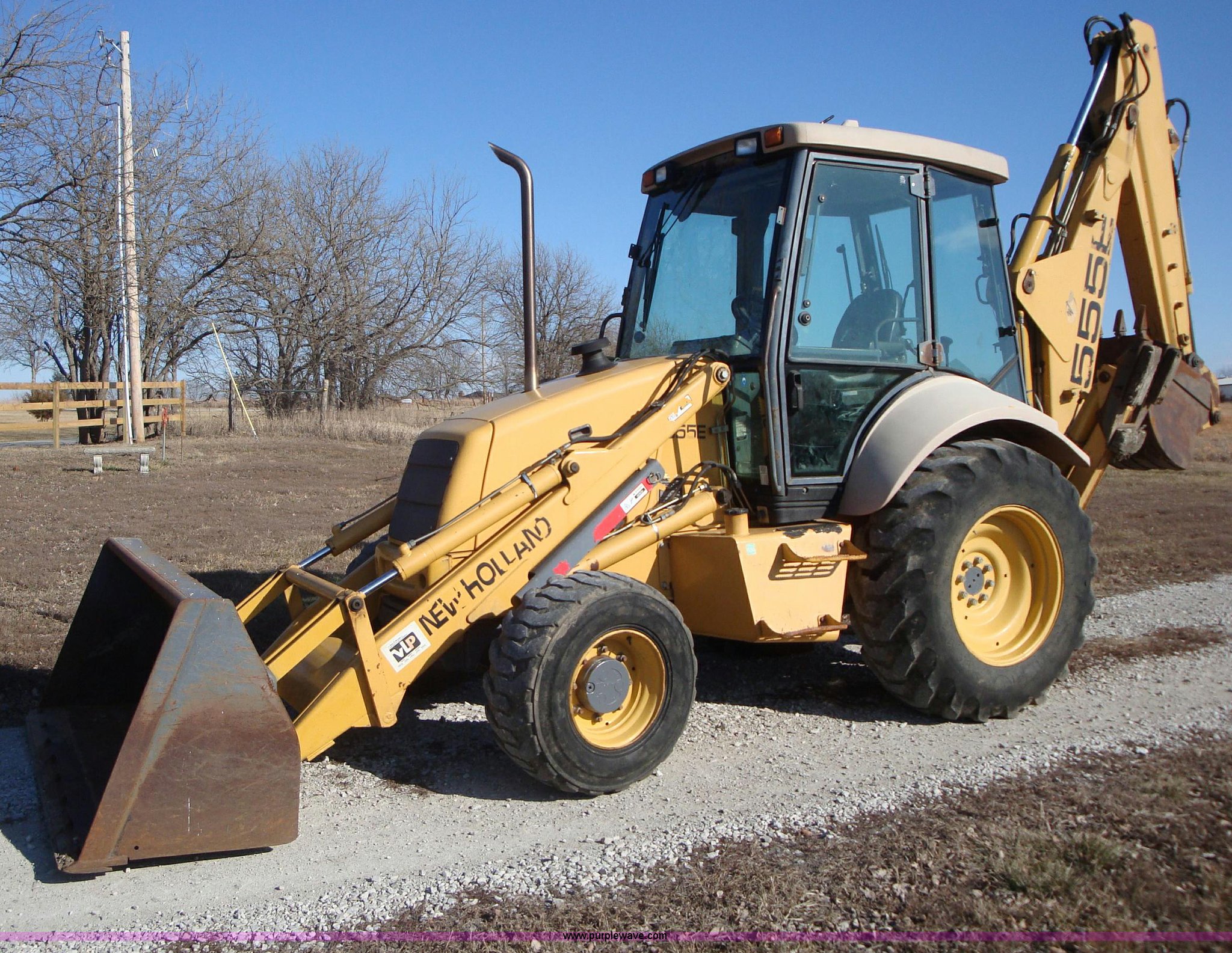 1999 New Holland 555E backhoe in Gardner, KS Item A1821 sold Purple