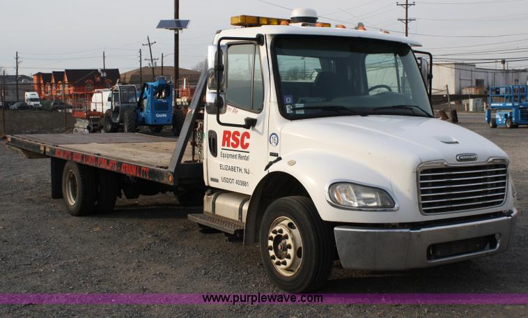 image for item A1882 2006 Freightliner M2 106 flat bed truck with hydraulic tail