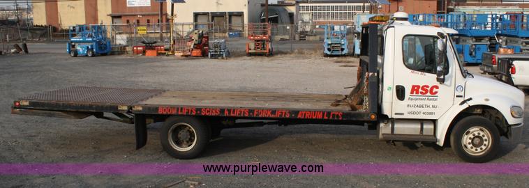 image for item A1882 2006 Freightliner M2 106 flat bed truck with hydraulic tail