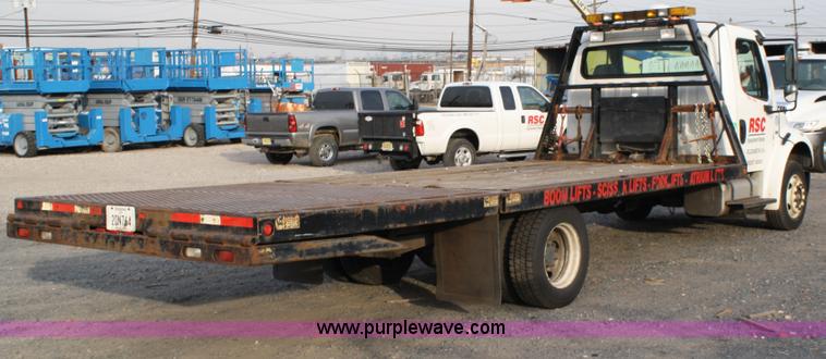 image for item A1882 2006 Freightliner M2 106 flat bed truck with hydraulic tail