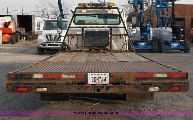 image for item A1882 2006 Freightliner M2 106 flat bed truck with hydraulic tail