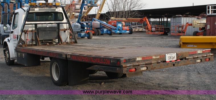 image for item A1882 2006 Freightliner M2 106 flat bed truck with hydraulic tail
