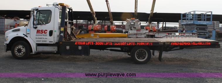 image for item A1882 2006 Freightliner M2 106 flat bed truck with hydraulic tail
