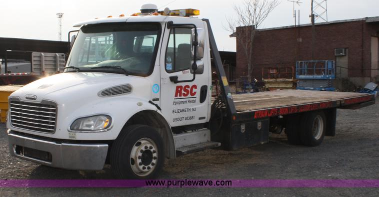 image for item A1882 2006 Freightliner M2 106 flat bed truck with hydraulic tail