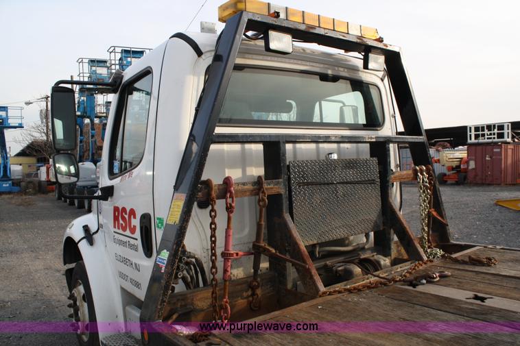 image for item A1882 2006 Freightliner M2 106 flat bed truck with hydraulic tail