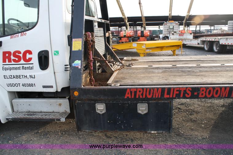 image for item A1882 2006 Freightliner M2 106 flat bed truck with hydraulic tail