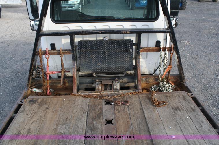image for item A1882 2006 Freightliner M2 106 flat bed truck with hydraulic tail