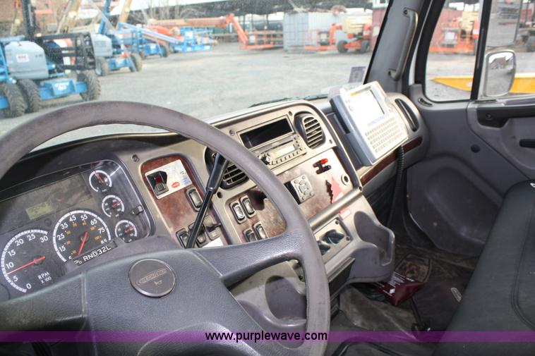 image for item A1882 2006 Freightliner M2 106 flat bed truck with hydraulic tail