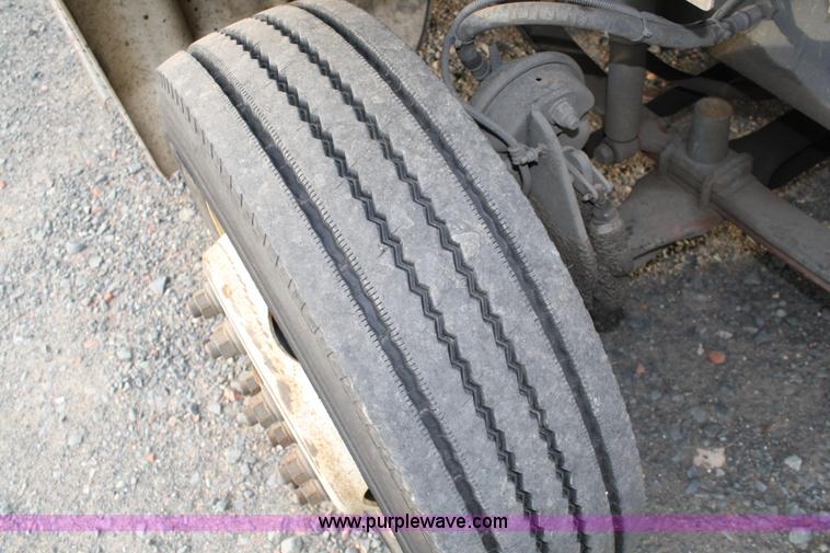 image for item A1882 2006 Freightliner M2 106 flat bed truck with hydraulic tail