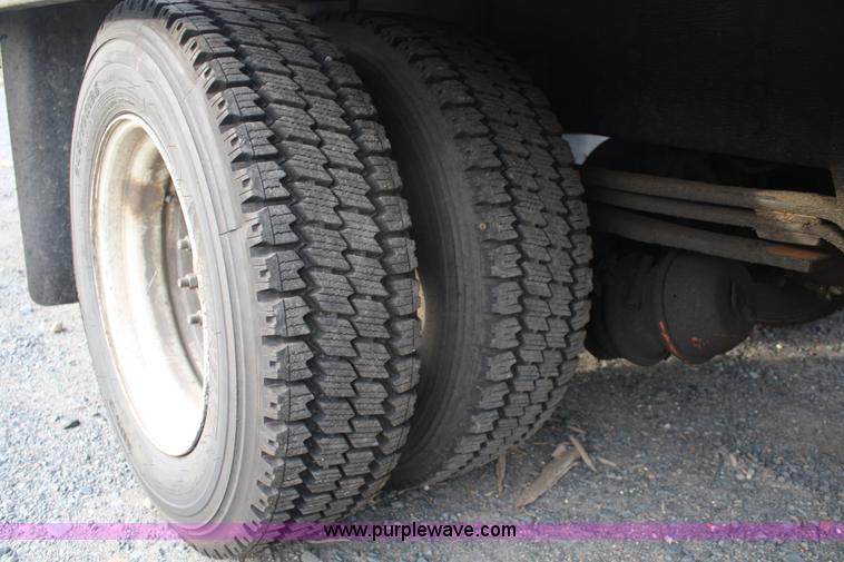 image for item A1882 2006 Freightliner M2 106 flat bed truck with hydraulic tail