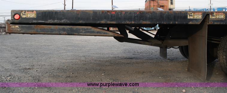 image for item A1882 2006 Freightliner M2 106 flat bed truck with hydraulic tail