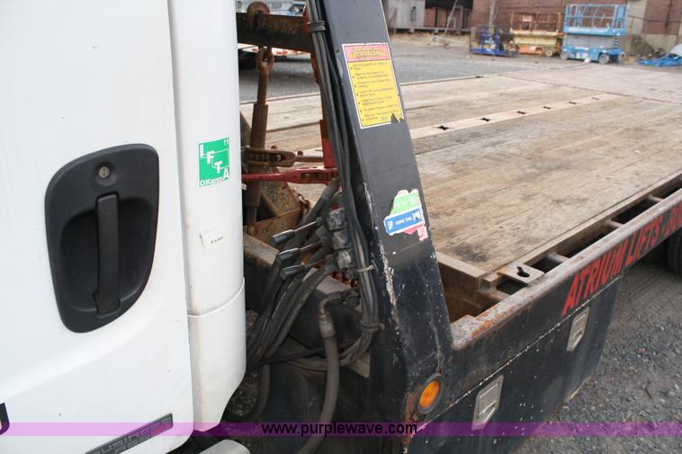 image for item A1882 2006 Freightliner M2 106 flat bed truck with hydraulic tail