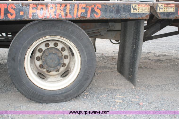 image for item A1882 2006 Freightliner M2 106 flat bed truck with hydraulic tail