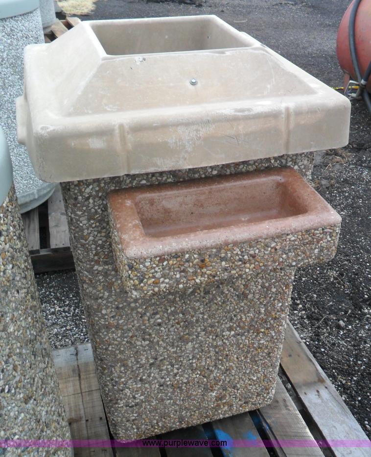 image for item A1946 (2) cast concrete trash cans