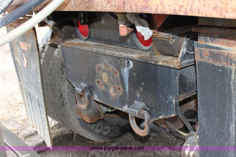 image for item A7166 1999 International 4900 tandem axle dump truck