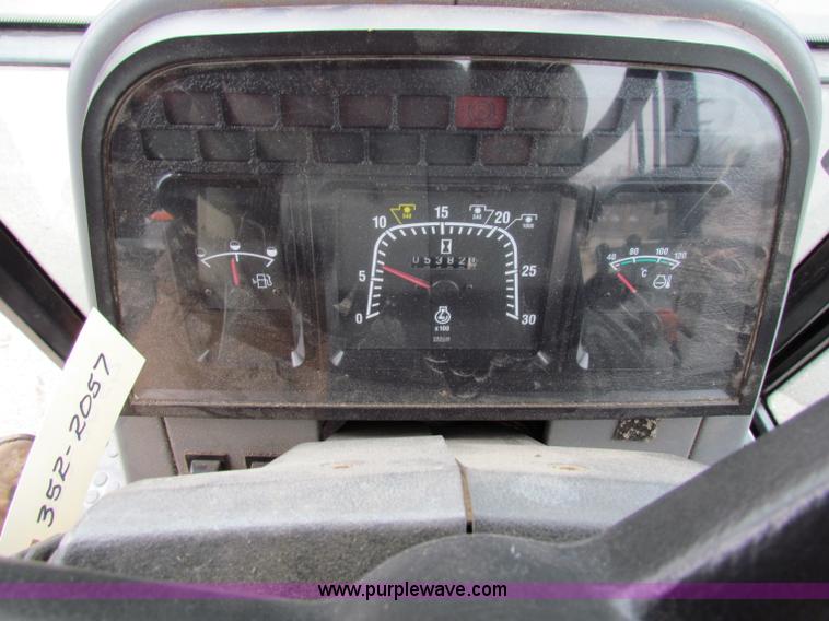 image for item B7074 1997 New Holland 6640SL tractor