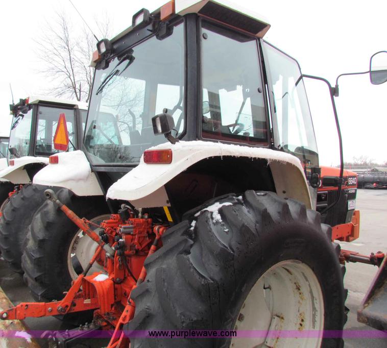 image for item B7076 1997 New Holland 6640SL tractor