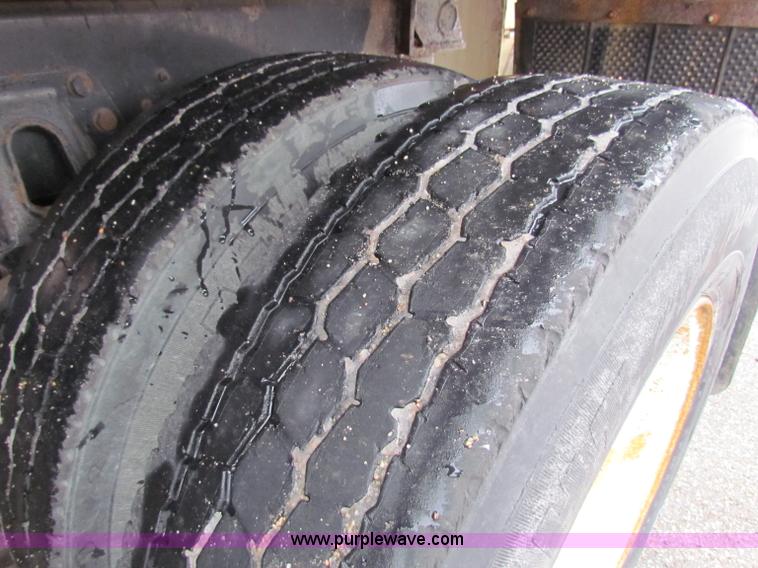 image for item B7128 1999 International 4900 tandem axle dump truck