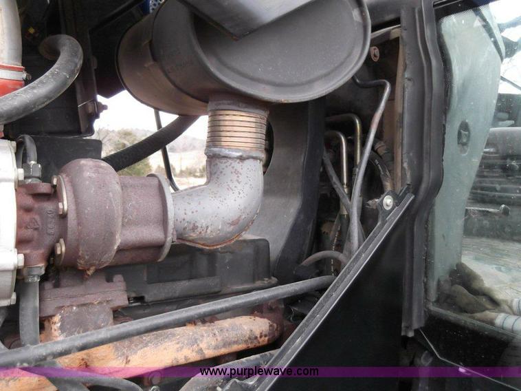 image for item B1010 2004 New Holland TM190 MFWD tractor