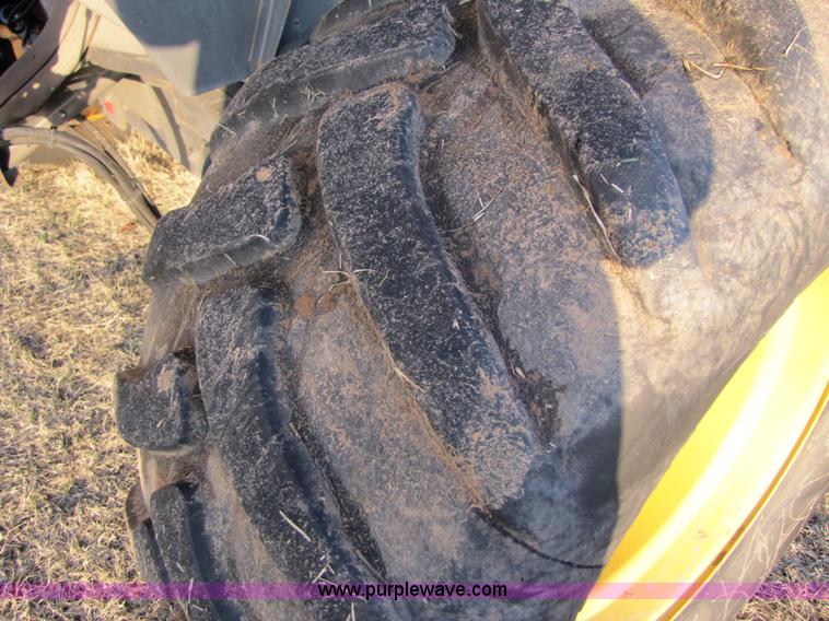 image for item B2210 2000 Caterpillar 470 Lexion RWA combine