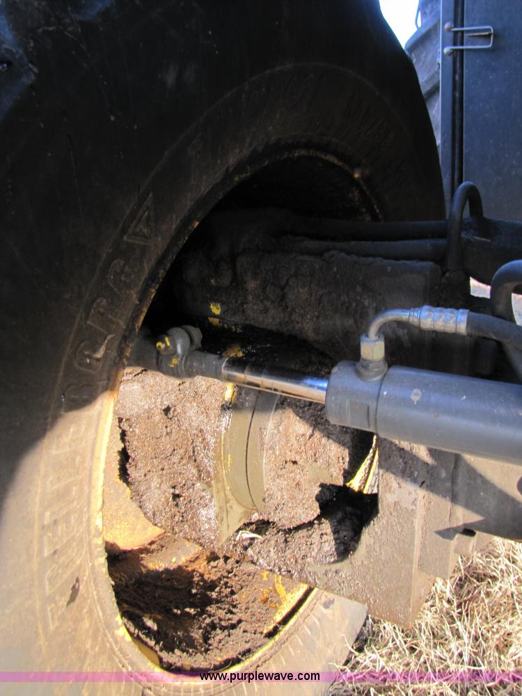 image for item B2210 2000 Caterpillar 470 Lexion RWA combine