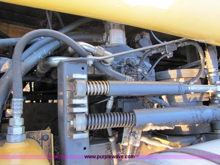 image for item B2210 2000 Caterpillar 470 Lexion RWA combine