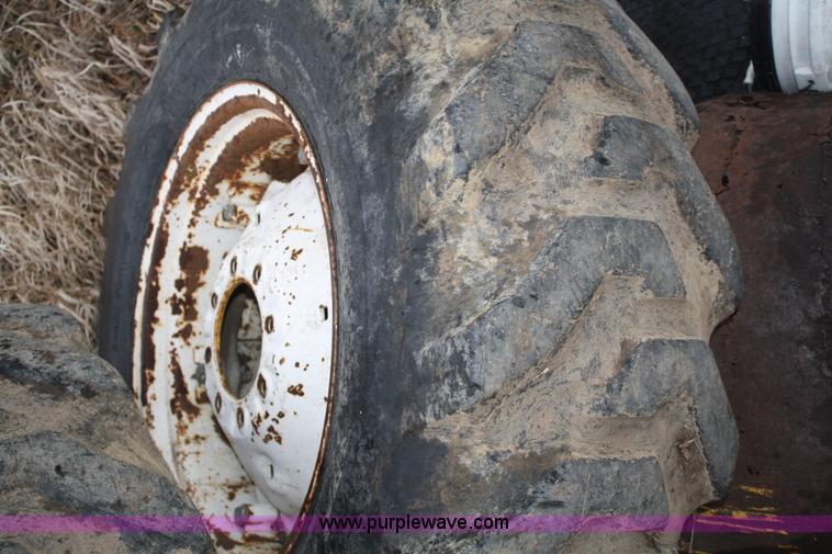 image for item H9621 (2) 14.9-24 tires and wheels